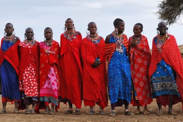 Maasai women in traditional red and blue robes in Kenya