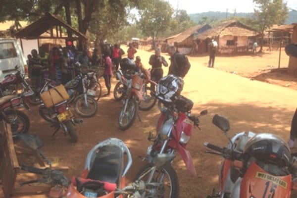 Motorcycles parked in a village during a MotorSafaris tour